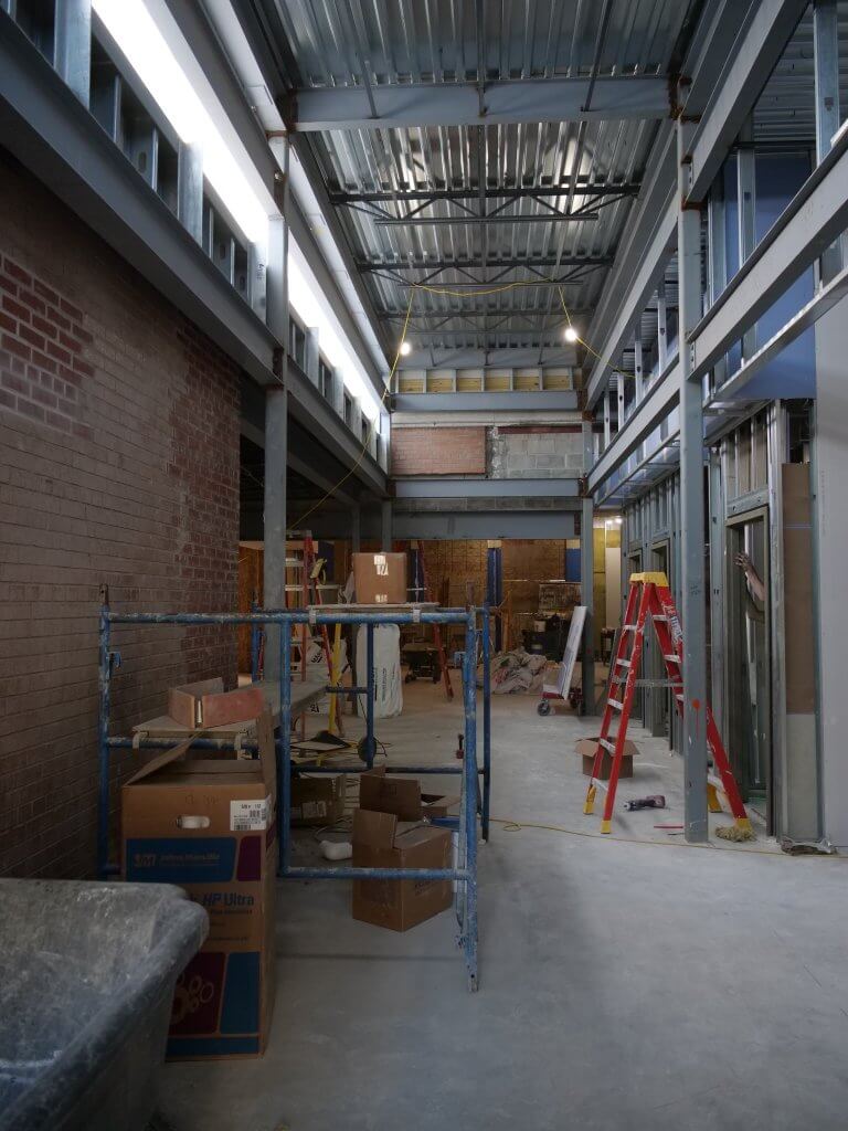 Unfinished construction photo of new entry from parking area